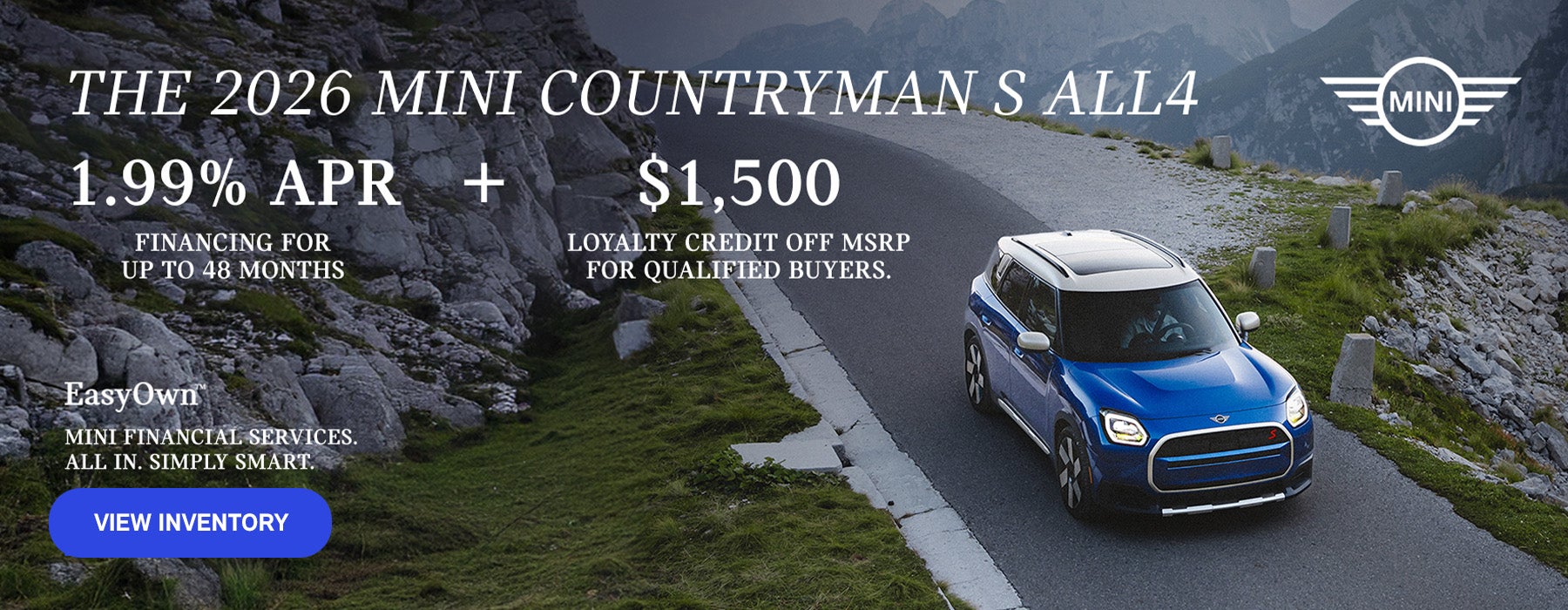 Front passenger side view of a MINI Countryman driving on a mountainous road.