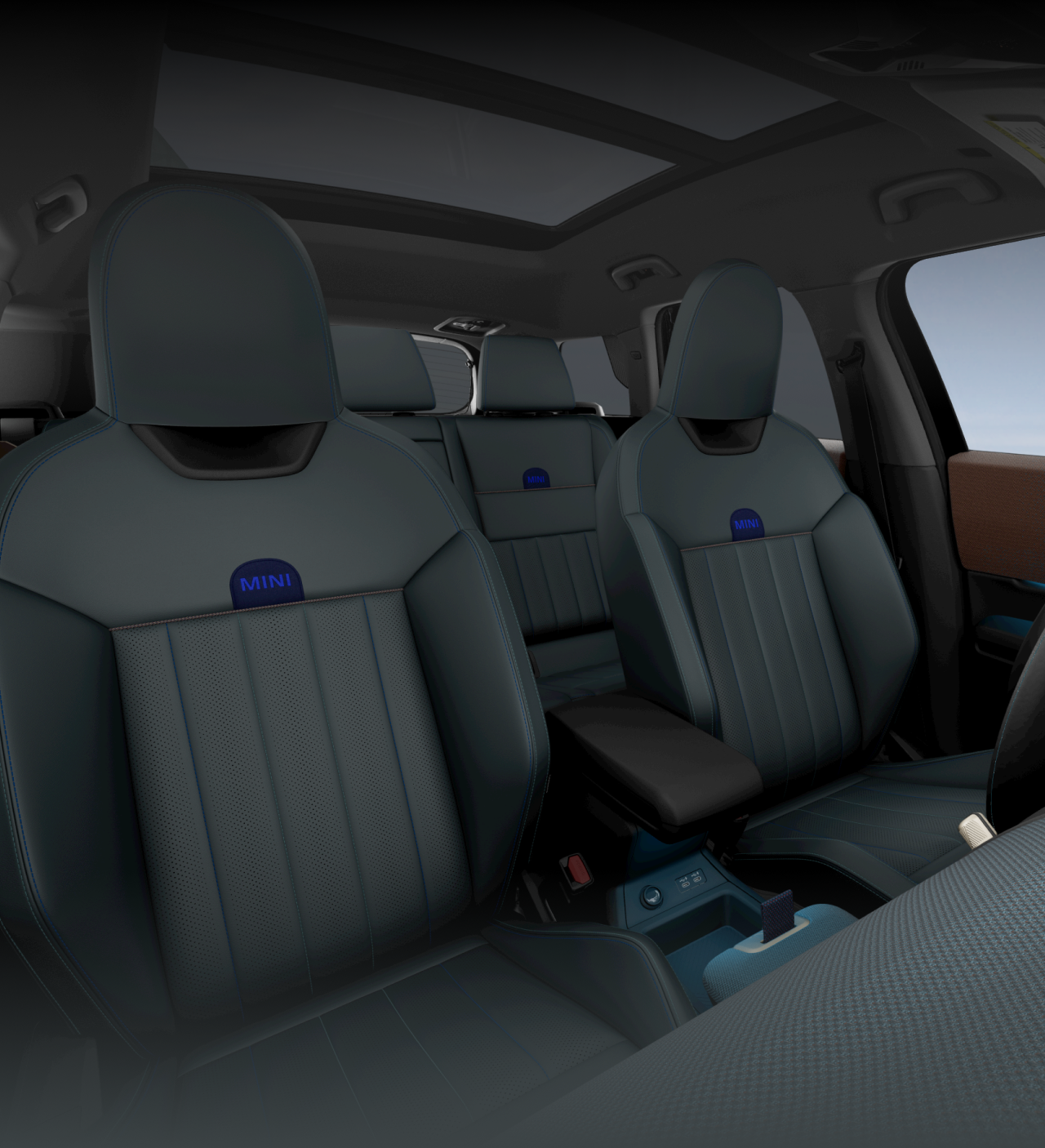 Angled view of the inside of the MINI Countryman SE ALL4 showcasing the front and rear Sports Seats. 
