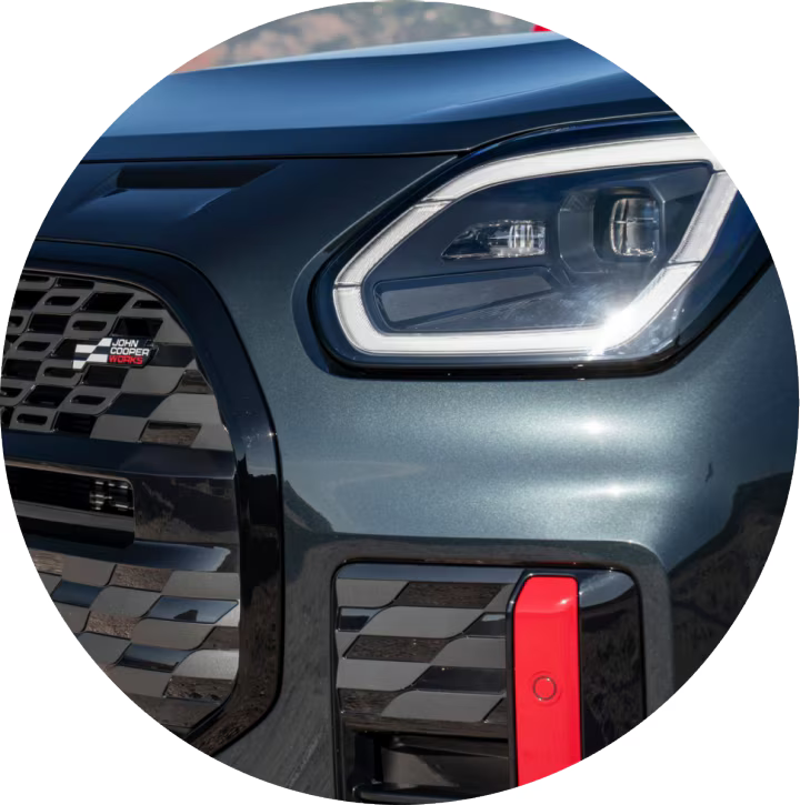 A close-up of a MINI JCW Countryman ALL4 headlight.