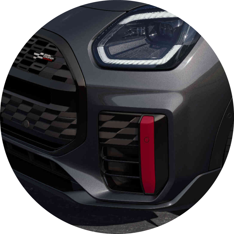 Closeup view of a front headlight on a MINI JCW Countryman ALL4.