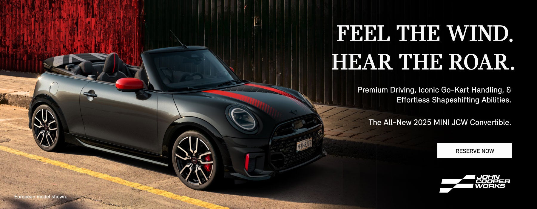  ¾ right view of a black MINI JCW convertible.